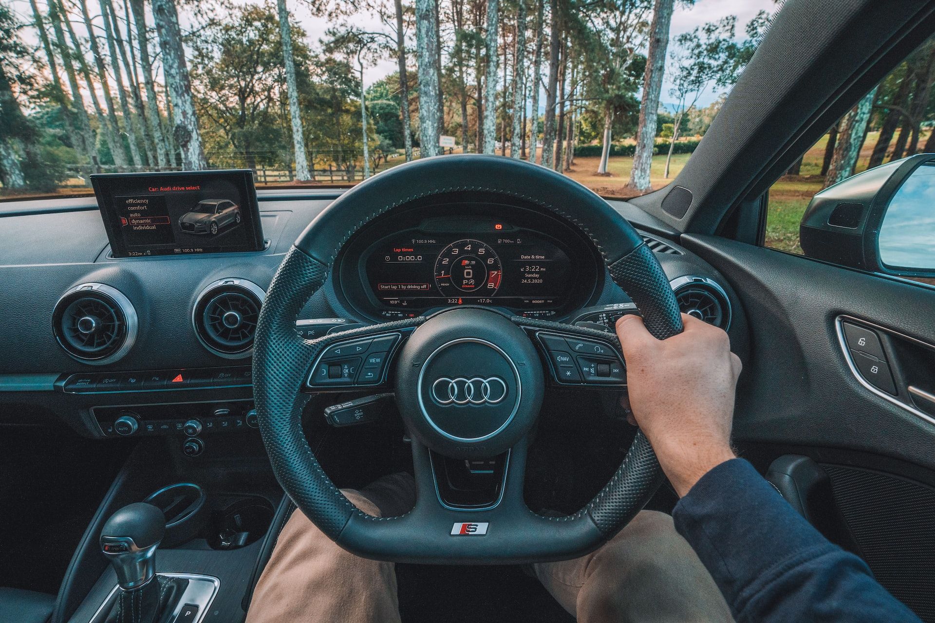 A modern steering wheel and dashboard